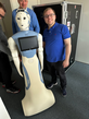 A picture of the new robot called ARI and Manuel Bied